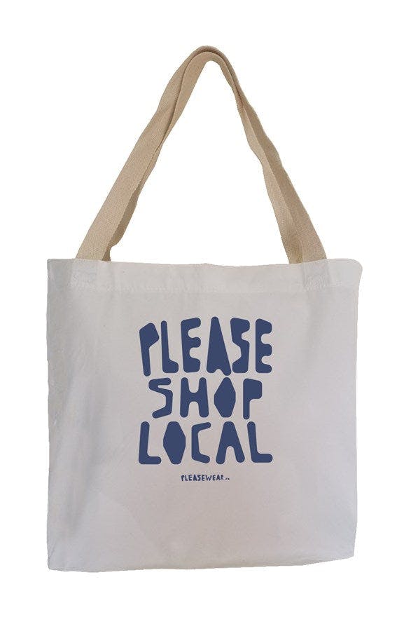 Natural colored tote bag that says 'please shop local'
